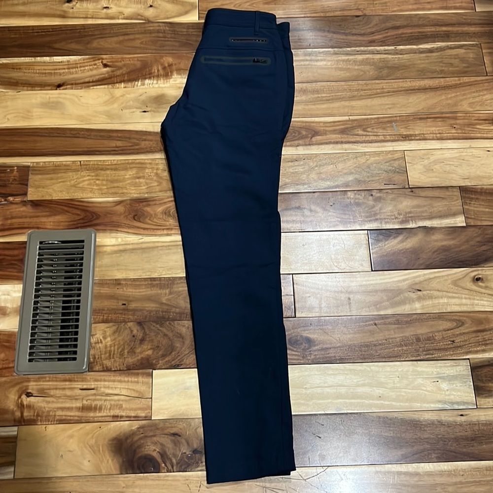 Lululemon high waisted tech pants, waterproof zippers.